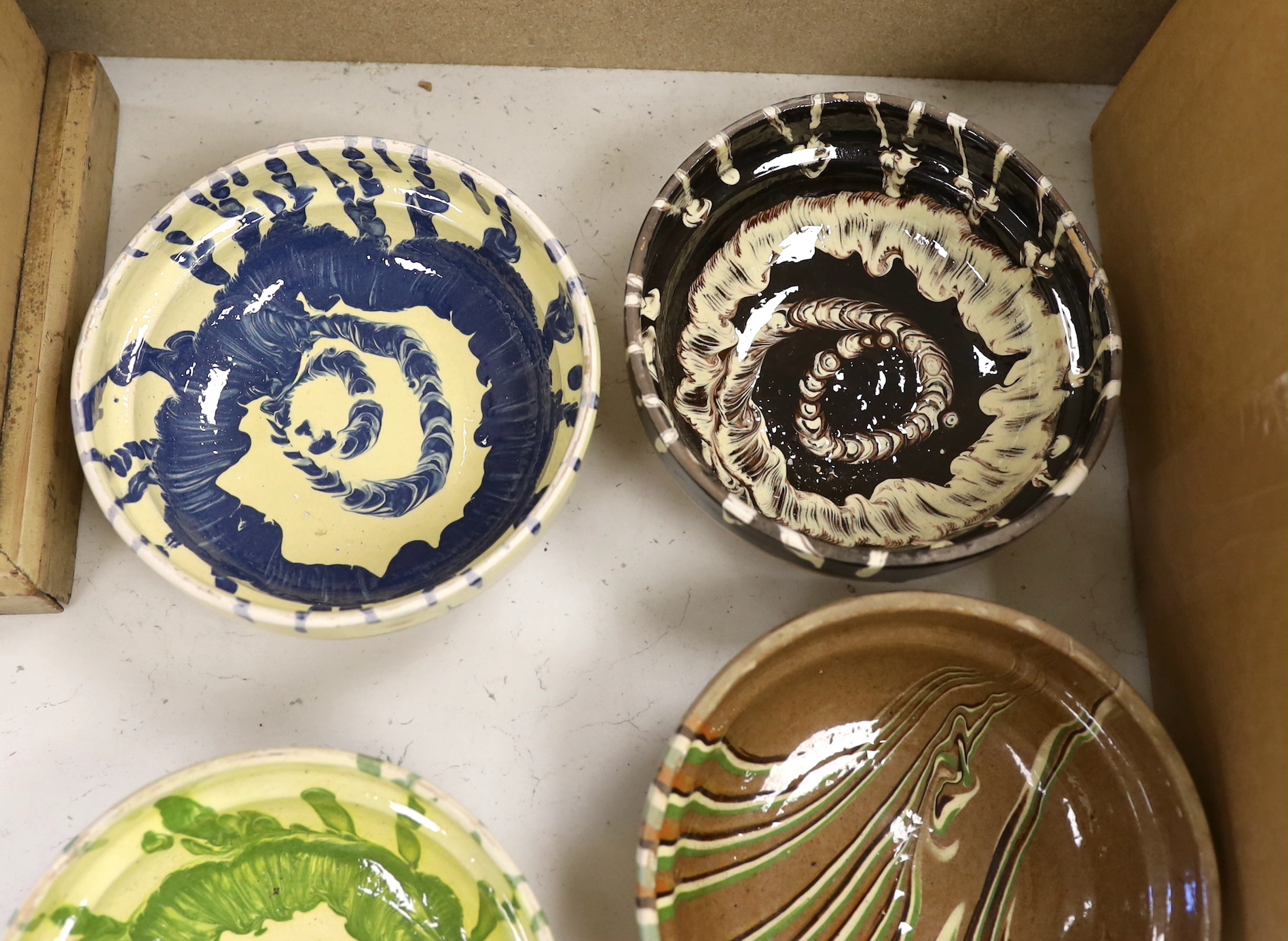 Six French slipware bowls, each 16cm in diameter
